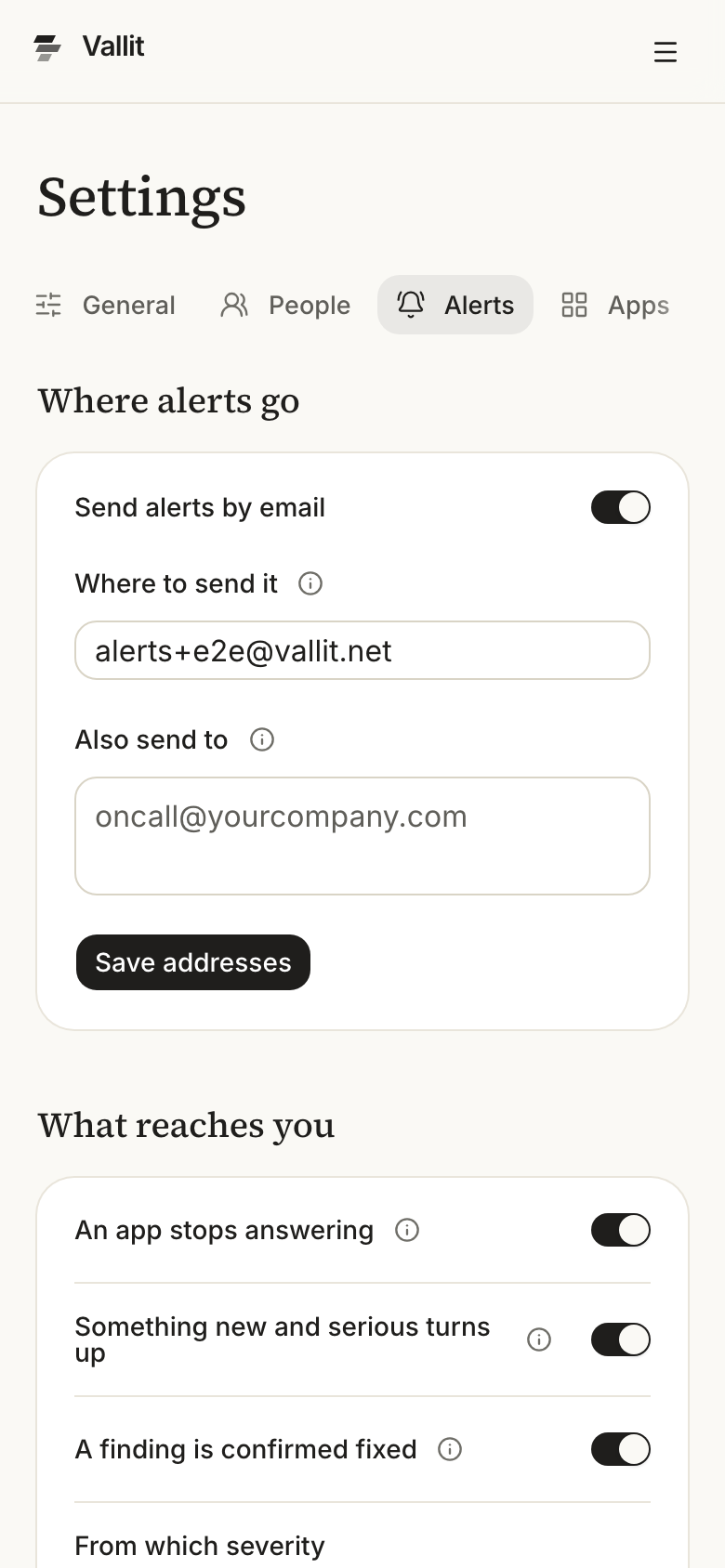 The Alerts section of the company settings with the Where alerts go card ringed: the Send alerts by email switch, the address fields and Save addresses. The What reaches you card with its three switches follows it. On a phone.